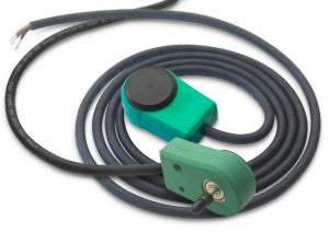 Green encoder with black rubber electrical cable attached and coiled up. 